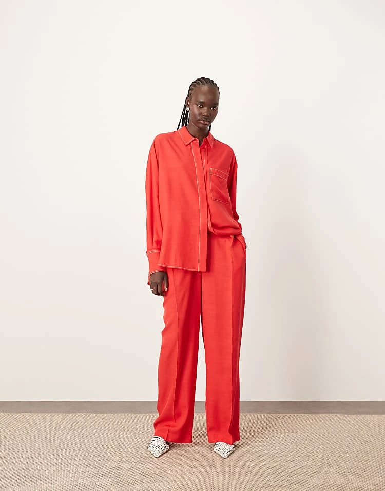 ARRANGE Oversized Contrast Stitch Shirt And Trouser Co-ord In Red 6 ARRANGE Oversized Contrast Stitch Shirt And Trouser Co-ord In Red - Image 4