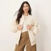 ARRANGE Textured Oversized Bomber Jacket In Cream For Women 1 ARRANGE Textured Oversized Bomber Jacket In Cream For Women -ARANG Clothing Shop 207359168 1 cream