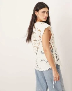 ARRANGE Cotton Cutwork Embroidered Top With Tie Side In Off White For Women -ARANG Clothing Shop 207646271 3