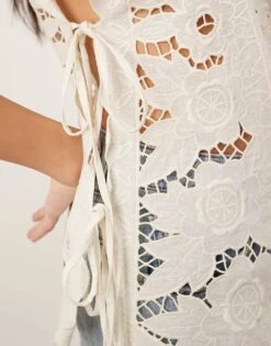 ARRANGE Cotton Cutwork Embroidered Top With Tie Side In Off White For Women -ARANG Clothing Shop 207646271 4