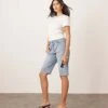 ARRANGE Cleo Denim Longline Short With Raw Hem In Mid Wash Blue For Women -ARANG Clothing Shop 207928921 1 midwashblue