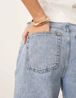 ARRANGE Cleo Denim Longline Short With Raw Hem In Mid Wash Blue For Women -ARANG Clothing Shop 207928921 4